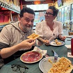 Feeding Crab Rangoon pizza to an Italian