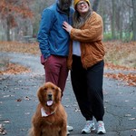 A happy couple and a happy dog