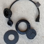 Modified the original passthrough and created a mount for the Noco plug to fit inside
